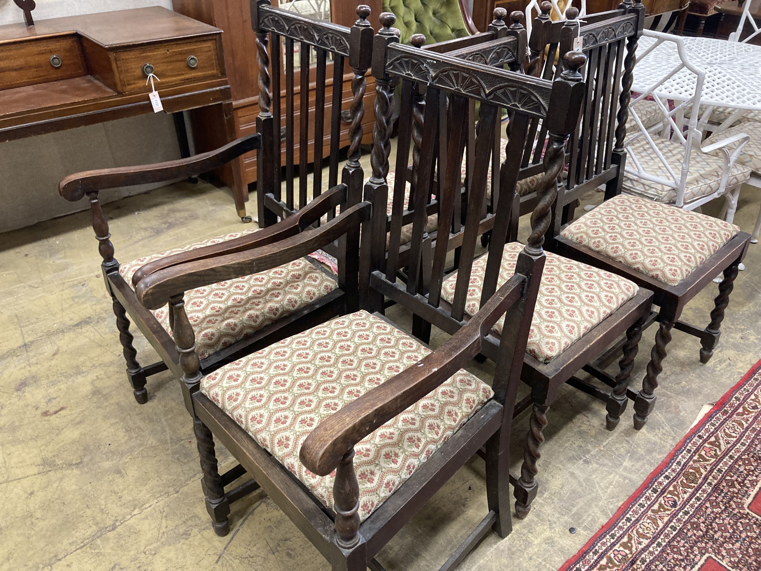 A set of six 1920's oak barleytwist dining chairs, two with arms